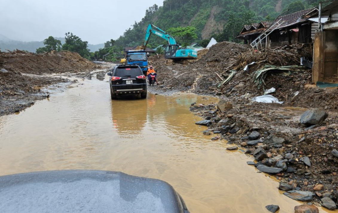 Hands holding a child sponsorship photo card