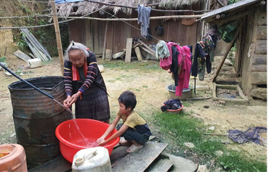 Hands holding a child sponsorship photo card