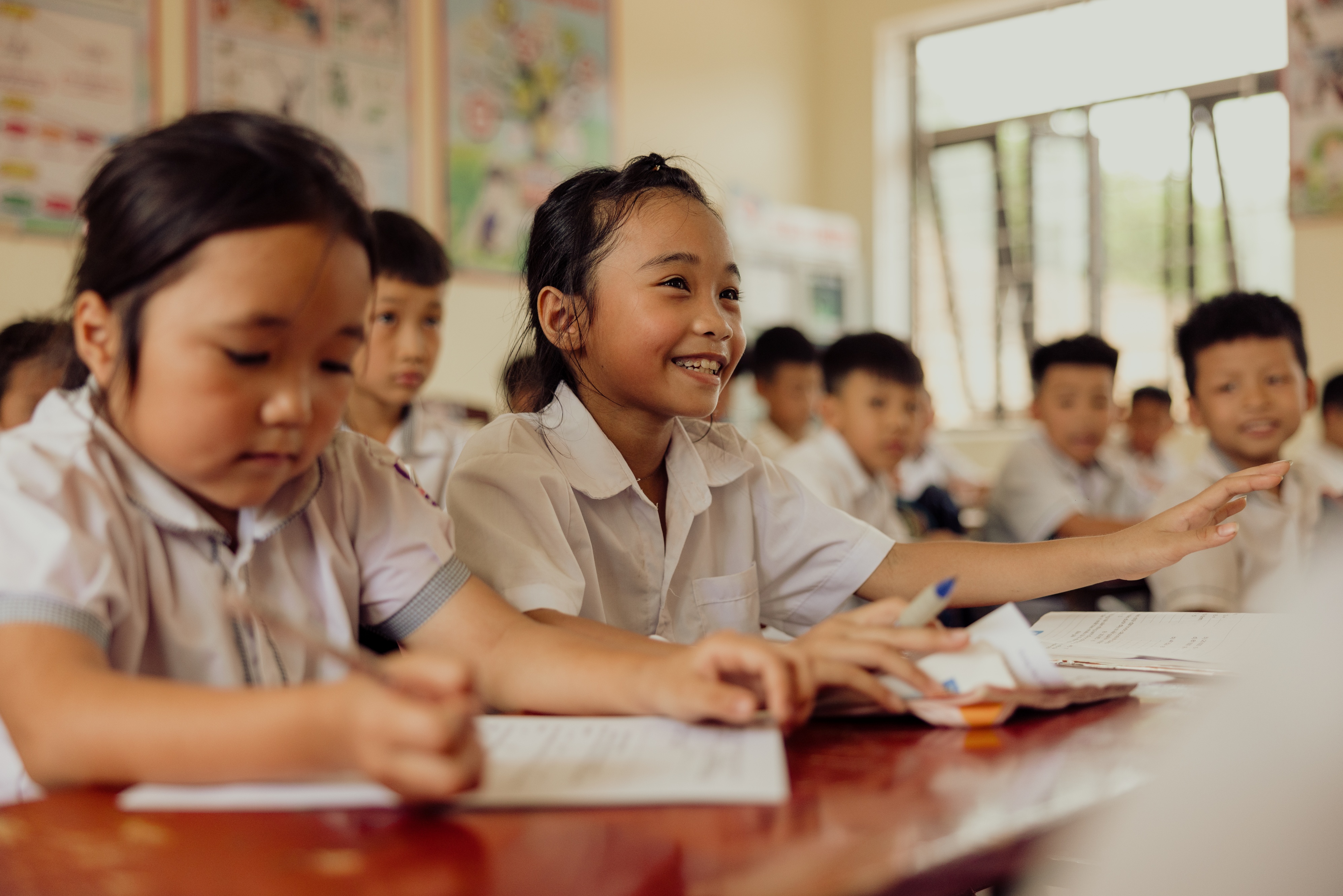 Hands holding a child sponsorship photo card