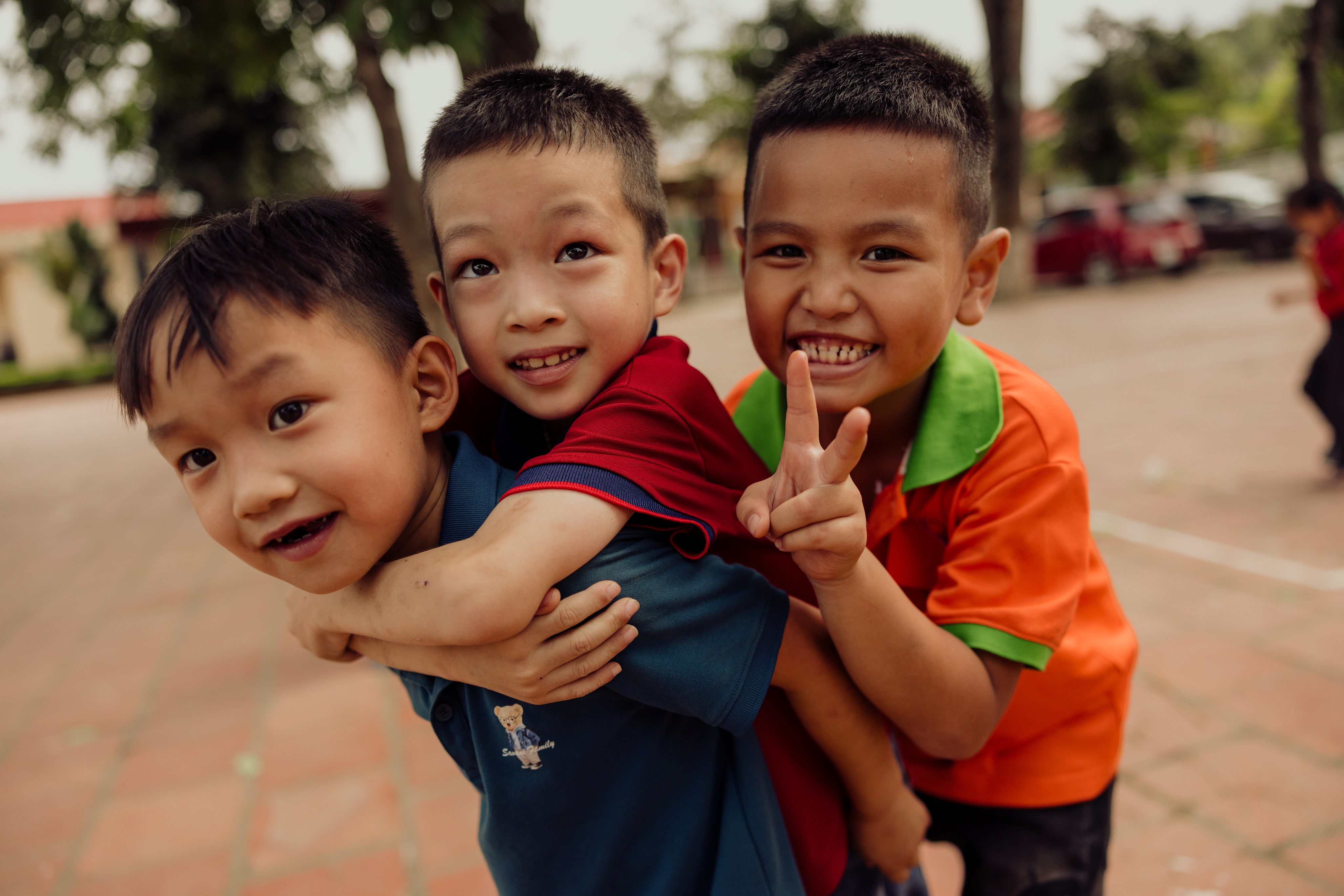 Hands holding a child sponsorship photo card
