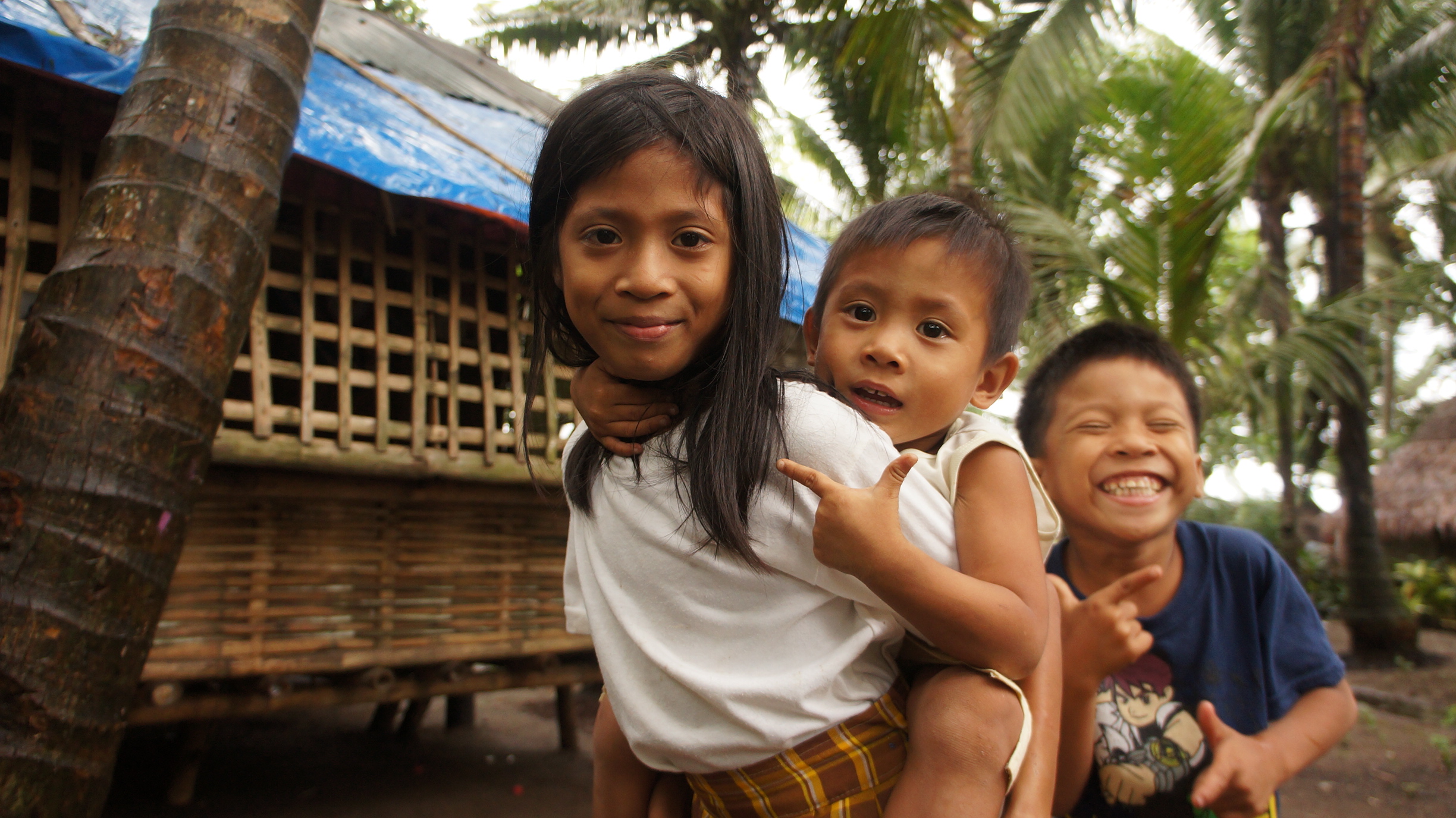 Hands holding a child sponsorship photo card