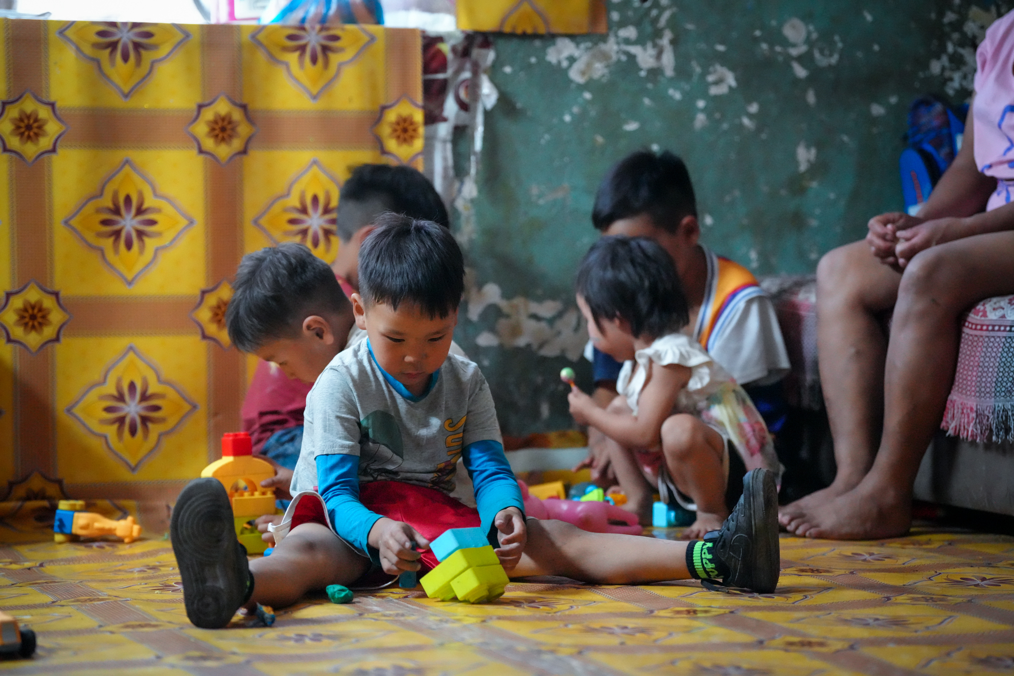 Hands holding a child sponsorship photo card