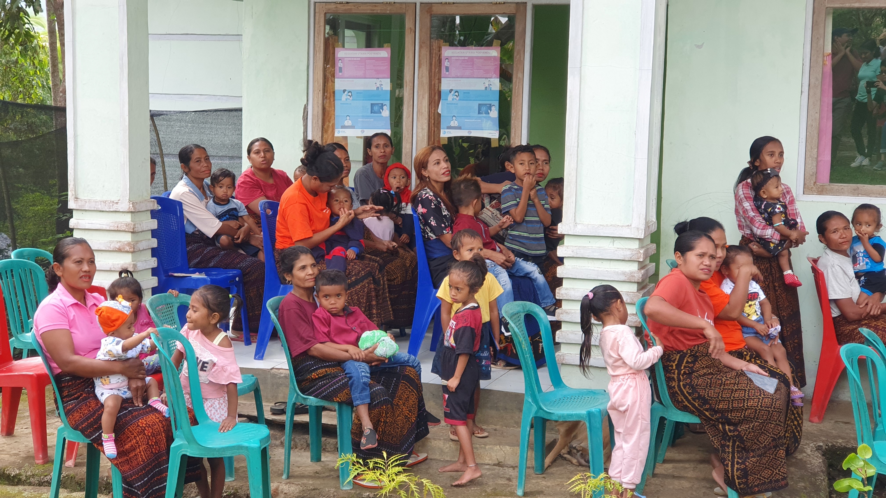 Hands holding a child sponsorship photo card