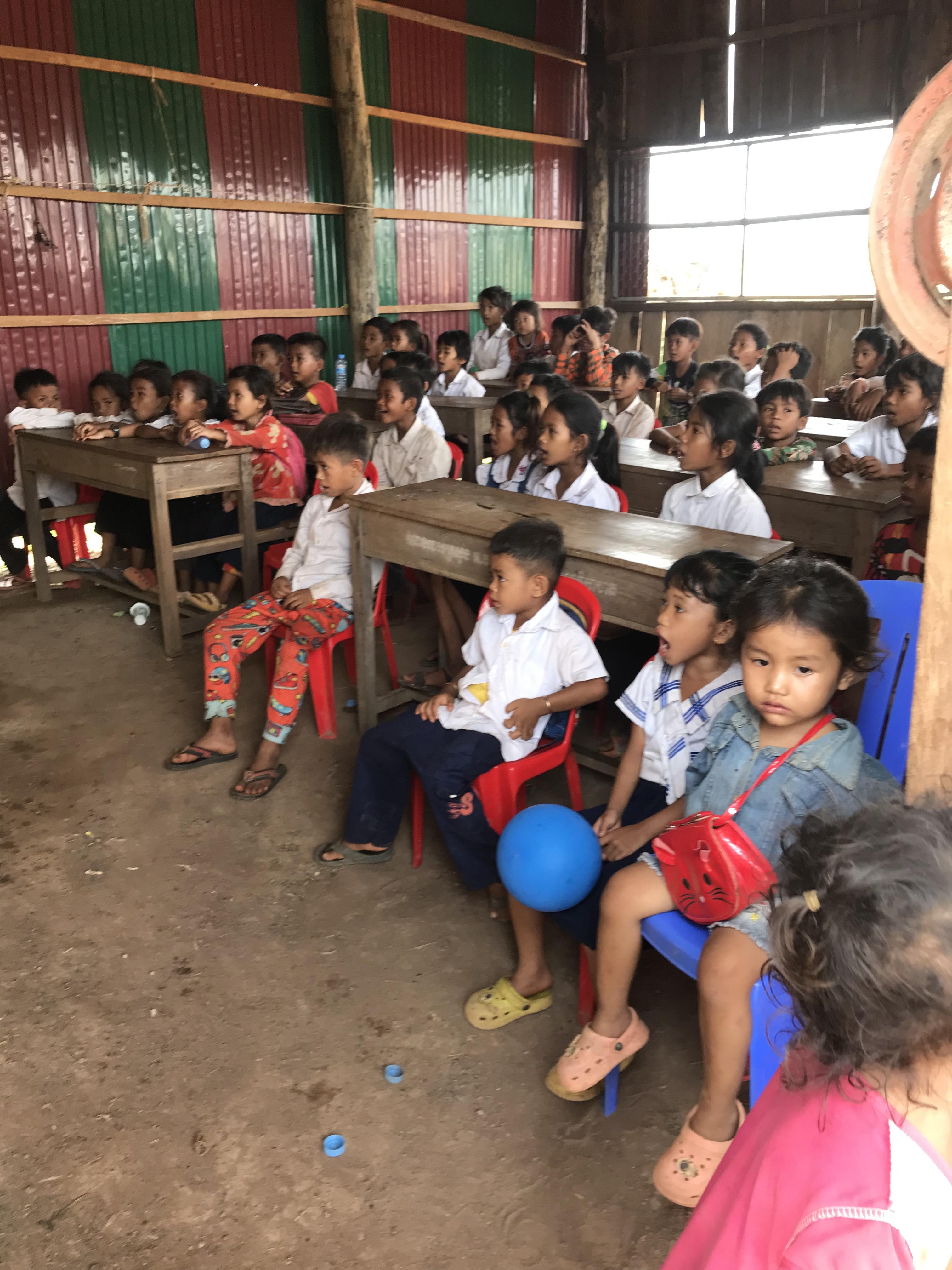 Hands holding a child sponsorship photo card