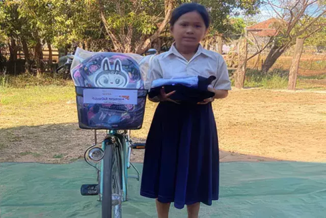 a girl with a bicycle
