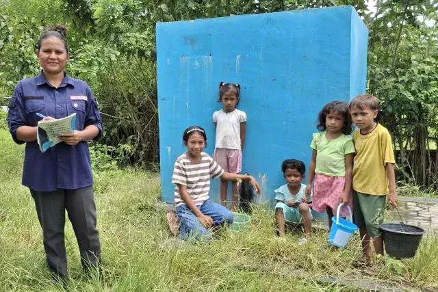child accessing water from World Vision projects in Ende Indonesia