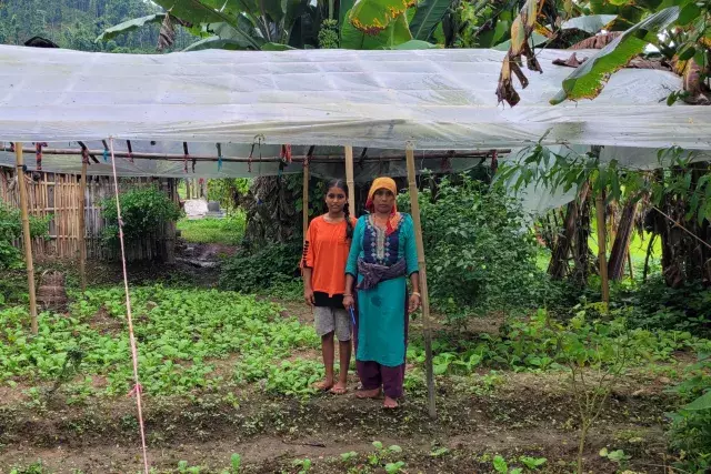 mother and child in their vegetable garden in Nepal