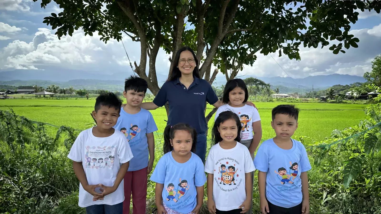 Children in Antique Philippines with World Vision staff in the field